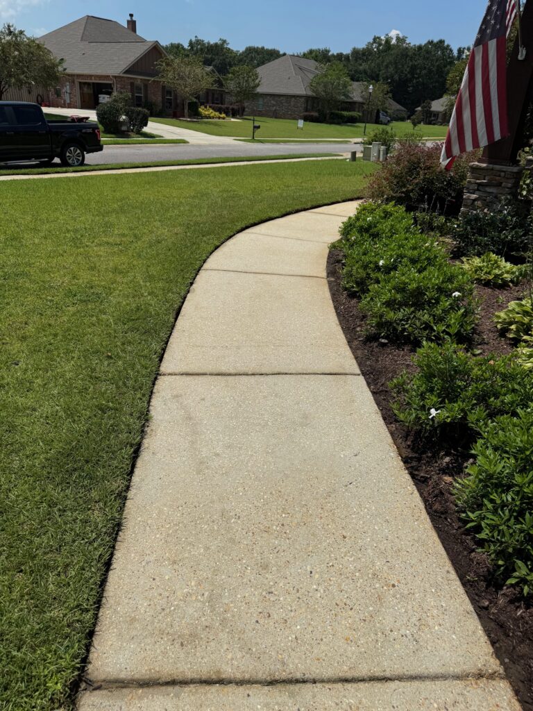 Pressure Washing a sidewalk